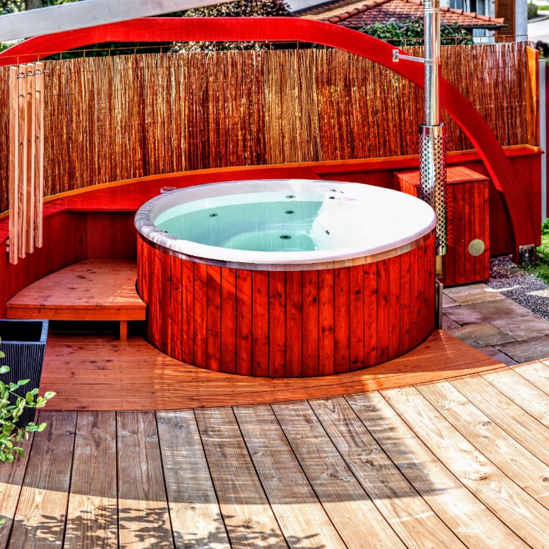 Wooden hot tub with integrated wood stove