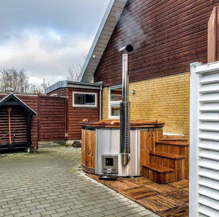 Wood burning hot tub with the integrated heater