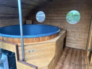 Outdoor oval sauna with an integrated hot tub (17)
